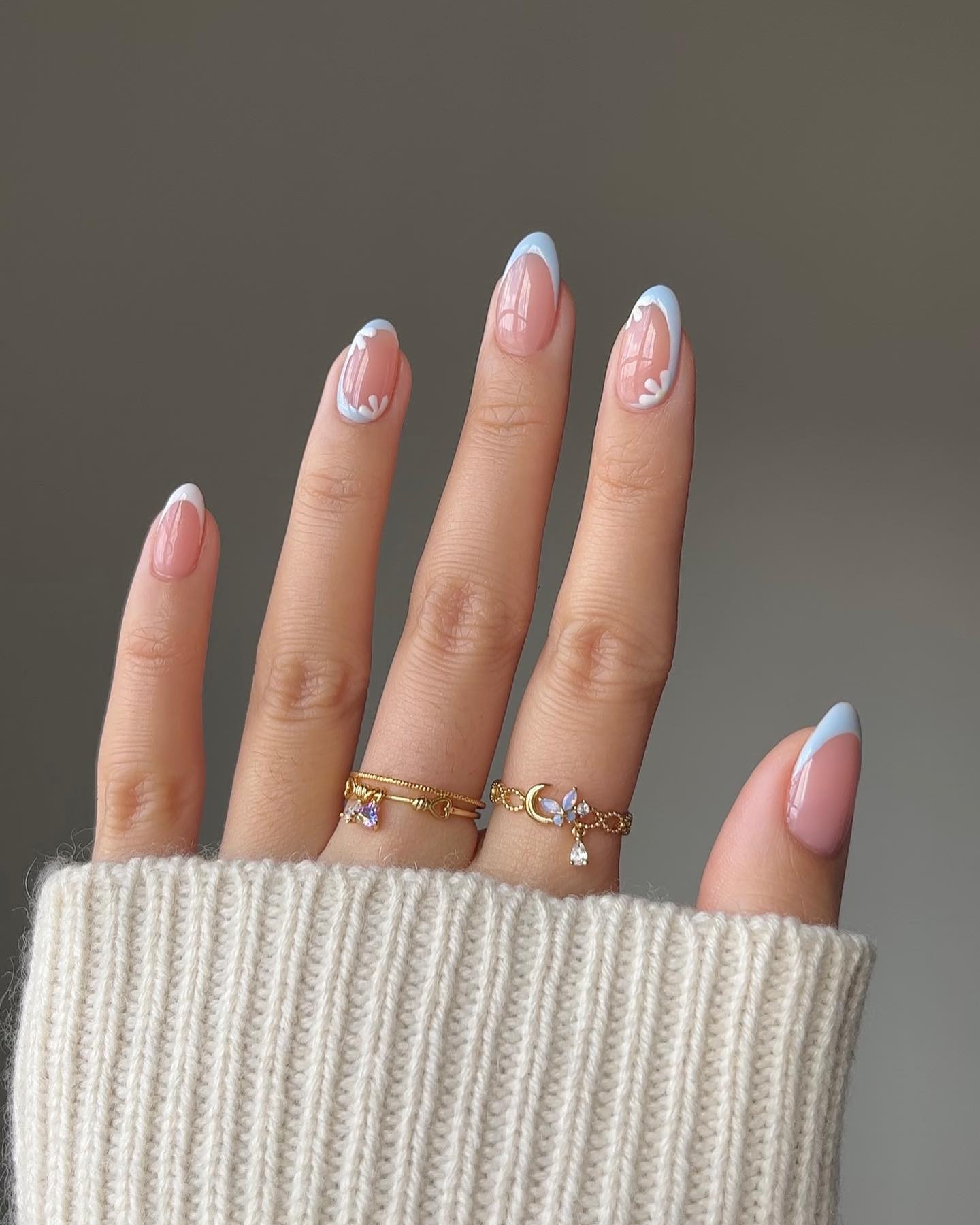 Charming blue floral French tip nails with dainty designs